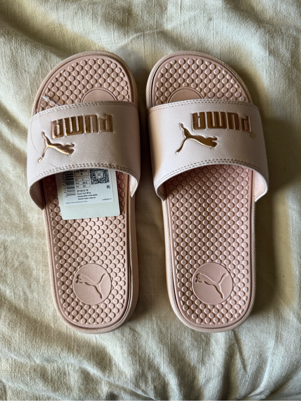 Puma Women's Pale Pink Slide Sandals with Gold Logo Accent